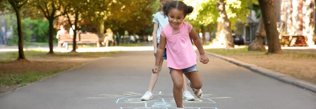 Kids playing chalk jump games